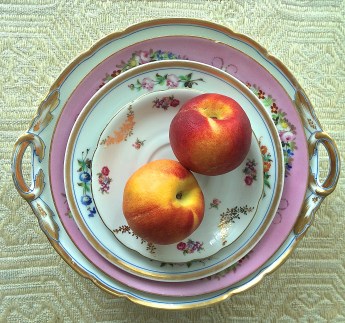 Peaches on golden plates
